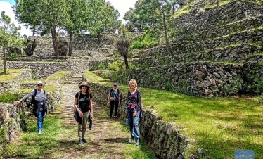 Reconstructed stone street and terraced structures at Cantona archaeological site in Puebla, Mexico.