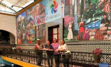 Murals celebrating Atlixco’s cultural identity painted on the walls of the Municipal Palace, showcasing local traditions, community pride, and artistic heritage.
