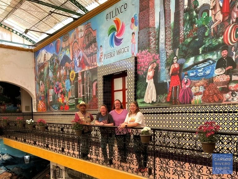 Murals celebrating Atlixco’s cultural identity painted on the walls of the Municipal Palace, showcasing local traditions, community pride, and artistic heritage.