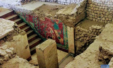 Photo of the mural at Cacaxtla during site exploration, showcasing vivid pre-Hispanic artwork and the immersive experience of uncovering Mesoamerican history.