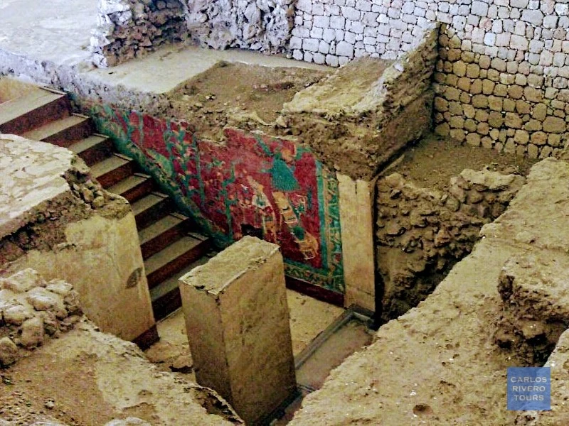 Photo of the mural at Cacaxtla during site exploration, showcasing vivid pre-Hispanic artwork and the immersive experience of uncovering Mesoamerican history.