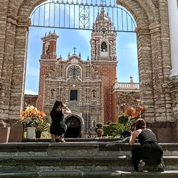 Visitors exploring Cholula’s iconic churches filled with baroque art and spiritual devotion, reflecting centuries of religious heritage and indigenous influence.