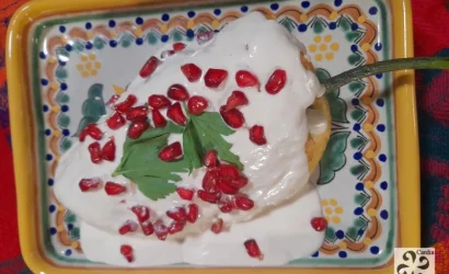 Chiles en Nogada plated on traditional Talavera ceramic from Puebla – showcasing Mexican culinary heritage with iconic dish and artisanal craftsmanship.