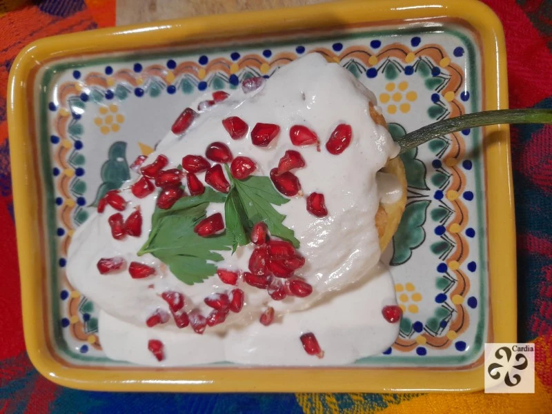 Chiles en Nogada plated on traditional Talavera ceramic from Puebla – showcasing Mexican culinary heritage with iconic dish and artisanal craftsmanship.