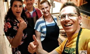 Participants preparing Mole Poblano in traditional cooking class in Puebla – guided culinary experience with local ingredients and cultural storytelling.