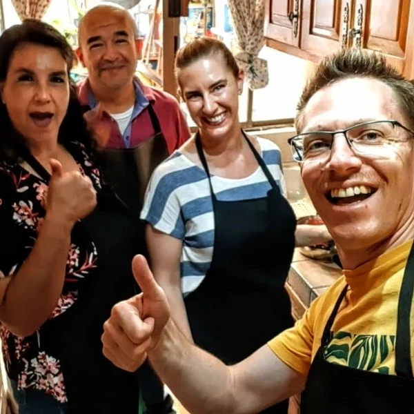 Participants preparing Mole Poblano in traditional cooking class in Puebla – guided culinary experience with local ingredients and cultural storytelling.